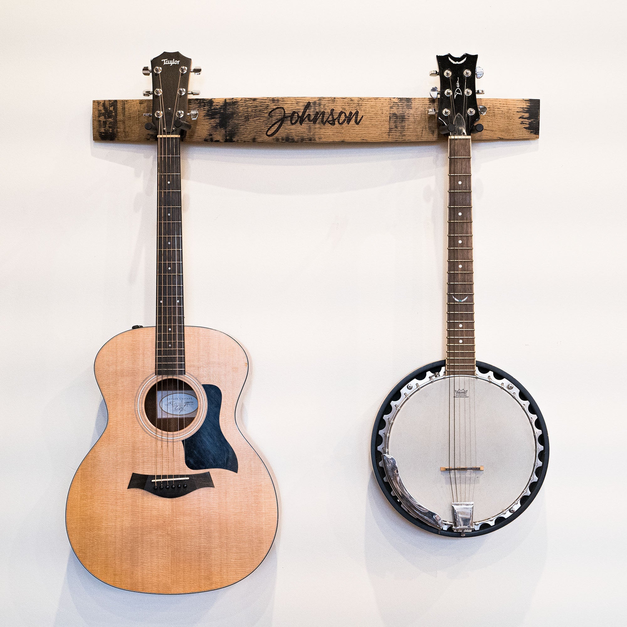 Double guitar holder made of Tennessee Whiskey Barrel with personalized name