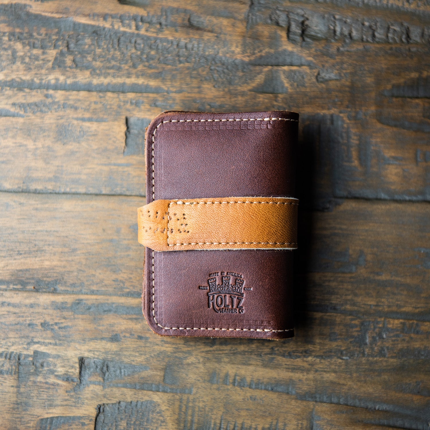 Front pocket wallet with snap closure made of vintage baseball glove